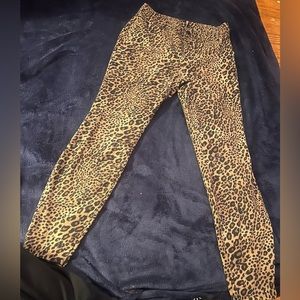 Women’s size medium leopard print leggings with back pockets and belt loops